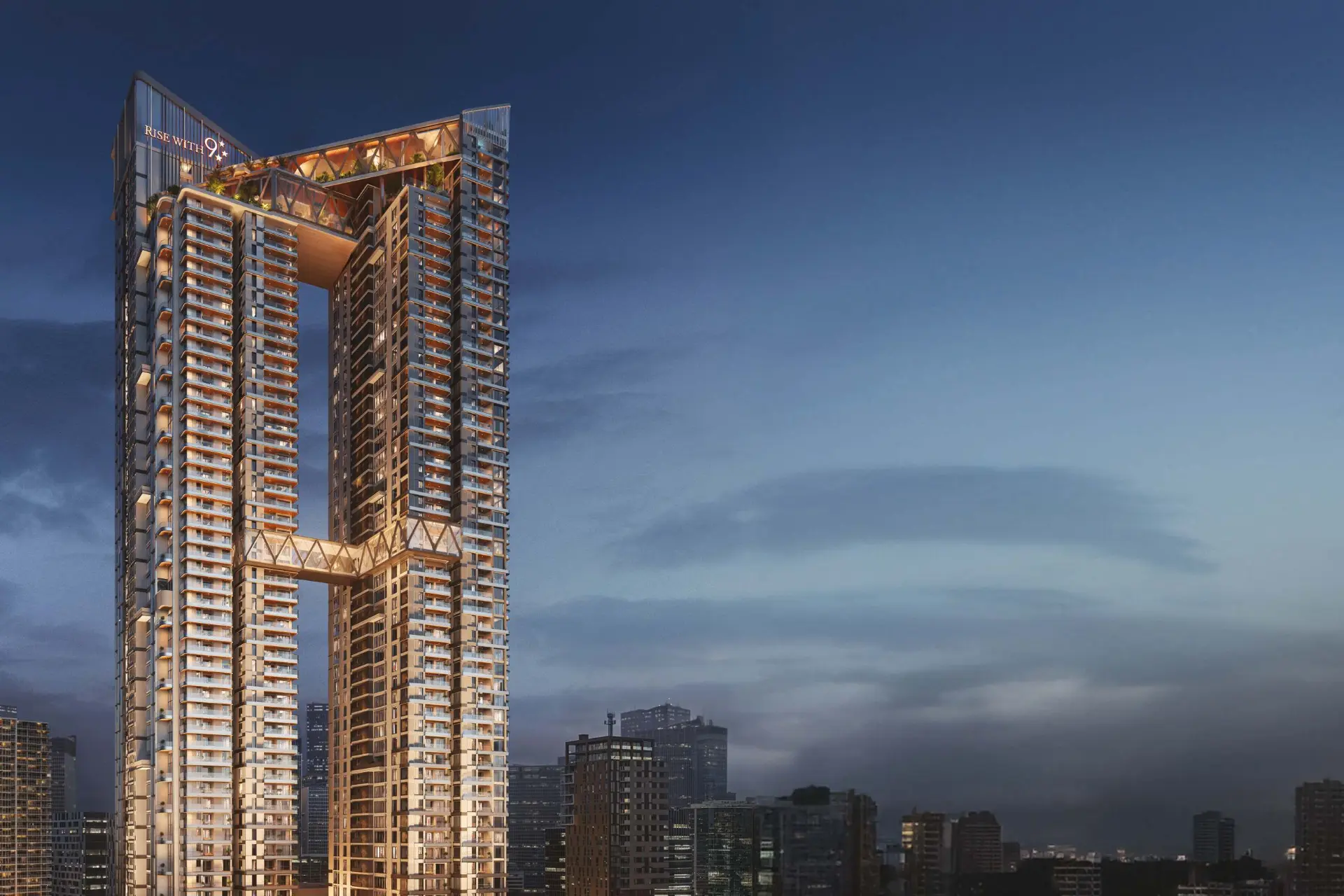 Twin towers and sky-bridges illuminated at blue hour
