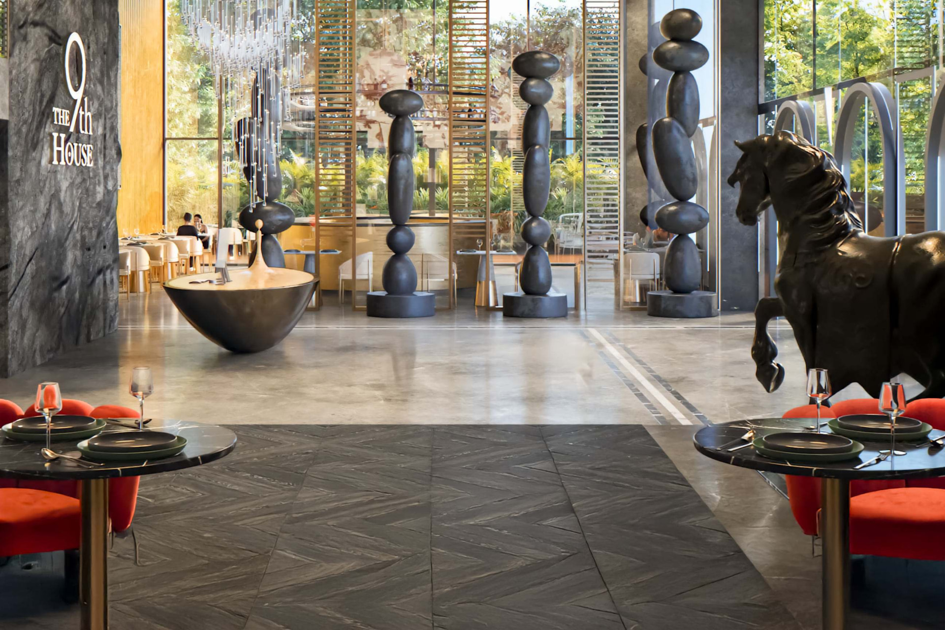 The 9th House dining hall with sculptural stone totems