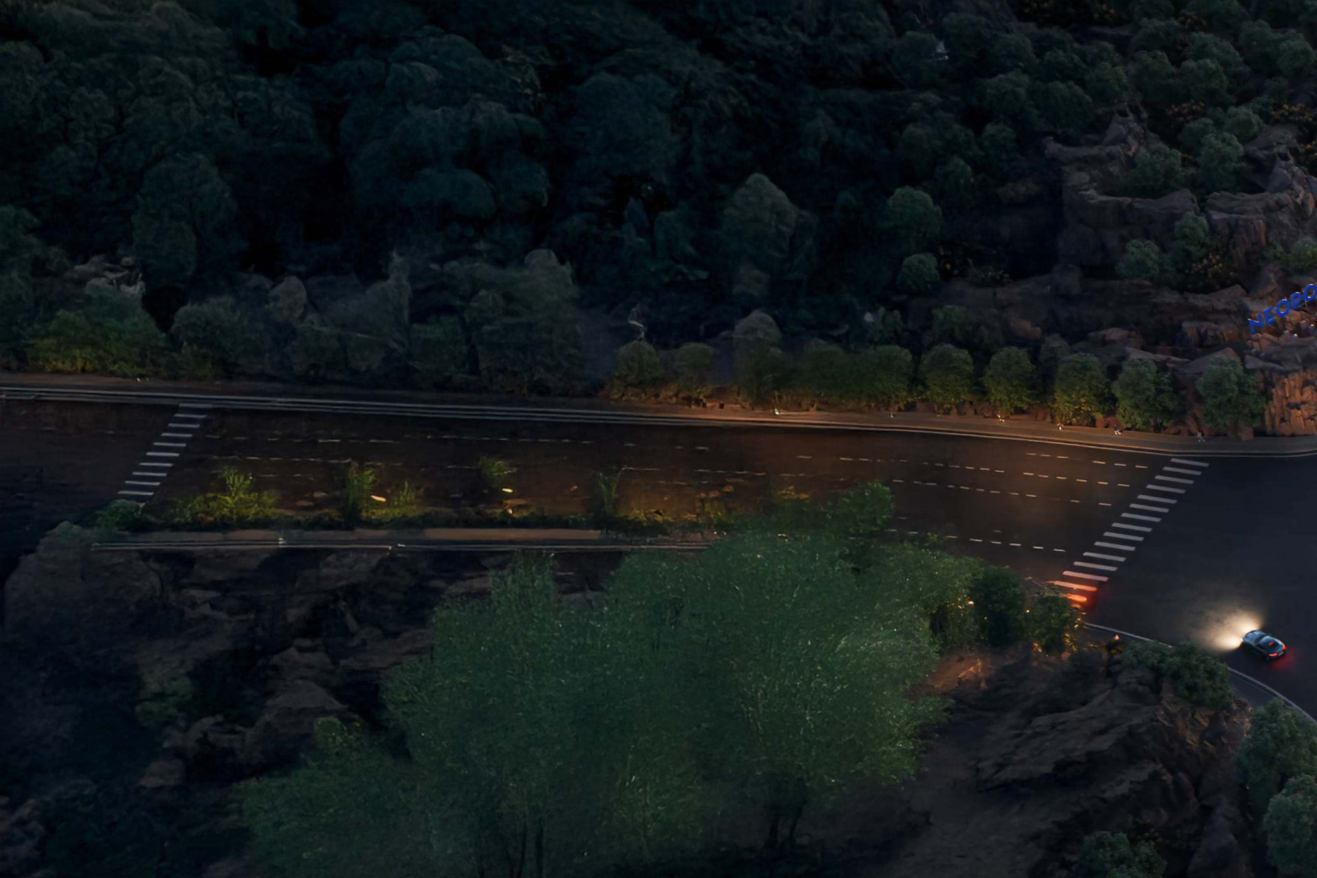 Approach road through the rock landscape at night